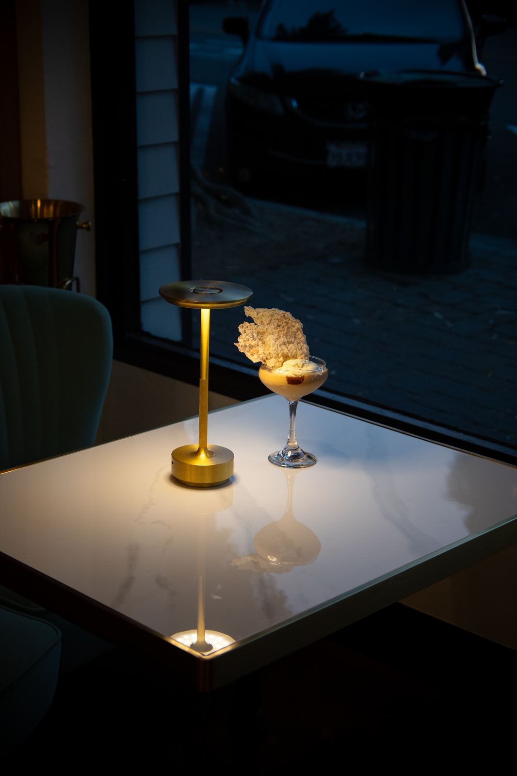 Candlelit window table set for two at Solera Kitchen + Wine Bar in Seal Beach